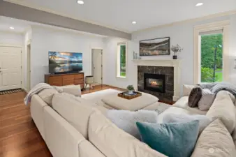 Great room showing hallway leading to guest bath & garage.