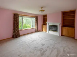 Bonus room with custom built-in's and gas fireplace with custom mantel