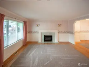 Living room with gas fireplace. Beautifal wainscoting