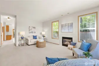 Large windows, towering ceilings, and gas fireplace