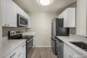 New cabinets, quartz, ss appliances, sink and fixture, vinyl-plank flooring-just completed.