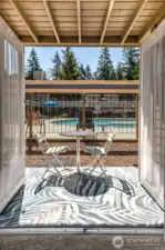Your view right outside the French doors. Storage closet is also on patio. No road noise; just pool fun and sun.