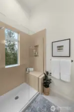 Soak your stress away in this luxurious tub surrounded by natural light and serenity.