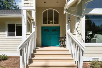 Stunning covered grand entrance leads to thoughtfully designed one of a kind home.