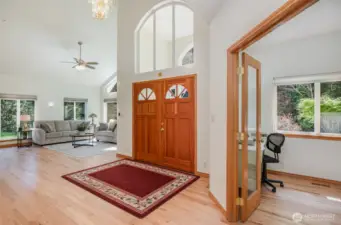 Home enters to soaring 16 foot vaulted ceilings with natural light pouring in from every direction.