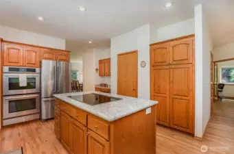This open kitchen is the heart of the home, seamlessly flowing into the family room for easy entertaining and family gatherings.