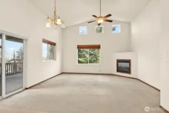 Living room w/gas fireplace & access out to the deck