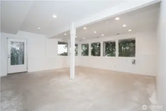 Basement level Studio or? Not pictured, is a long stainless counter and sink.