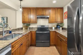 The kitchen has been updated with newer cabinety, a farm house sink with newer faucet and newer appliances