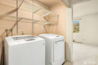2nd level laundry area with newer washer and dryer