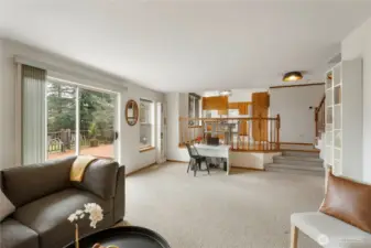 Generous size family room with access to the patio, deck, another coat closet, 3 car garage and the laundry plus 1/2 bath.