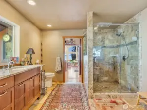 Custom granite and tile shower and bathroom built by local company to unwind after a full day of living.