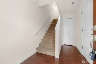 Front entryway with garage to right and storage closet