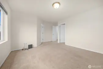 Primary bedroom walk in closet