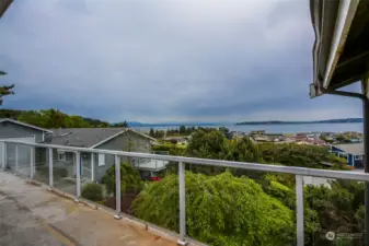 Picturesque views from the large deck of the sound, mountains and community.