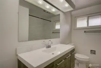 Updated Main Bathroom on the main level near the 2nd bedroom. Tub/Shower with tiled surround.