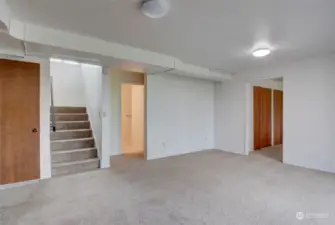 Stairs down to the lower level and the Family Room area.