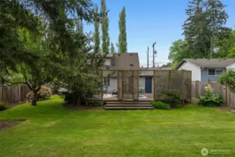 Beyond the perfect entertaing deck is this deep, fully-fenced backyard - room for sport or play of all sorts, for fiddo, for veggie gardens, of even a entire fruit orchard!  Or just enjoy the lush, green, shady space...