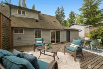 Just in time for summer!!!  What a lovely, private, and large deck through sliding doors off of your living space!