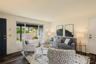 Charming great room with living-dining-kitchen spaces.  South-facing with big windows to the south and north to capture lovely natural light.