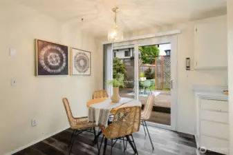 Lovely eating space and sliders that extend the flow of your living space and invite you to enjoy this amazing backyard!