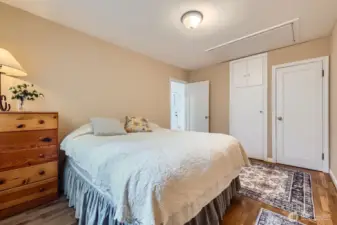 This shot shows the two separate closets and access to the attic.