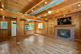 What a Welcome Bonus to have this Flex Space within a Home~Newer Flooring~High Open Beam Ceilings~Wood Burning Fireplace~Walk out to the Back Yard & Patio~