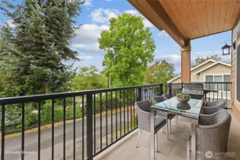 Covered BAlcony of the Primary Bedroom on upper level. Virtually Staged