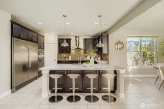 A bar to pull up a seat and entertain guests while cooking.