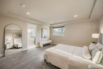 Primary bedroom with en suite bath and walk-in closet.