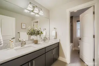 Full bath off hallway serving the three bedrooms.