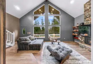 Great Room with Tall Ceilings and River Rock Fireplace