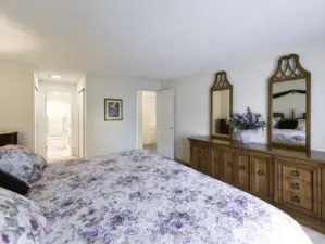 Primary bedroom w/ attached primary bath, and closets.