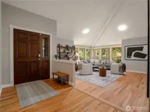 The neutral color palette flows throughout, w/gleaming hardwood floors, vaulted ceilings, & wood-wrapped windows that frame the lush Pacific Northwest landscape at every turn.