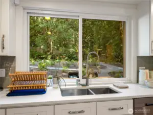 Enjoy the views of the spacious gardens and greenbelt which provides privacy & a tranquil backdrop year-round.