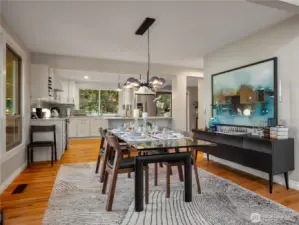 The dining room has ample room to accommodate a table for 12. And, there is space in the kitchen for an informal dining table and chairs.