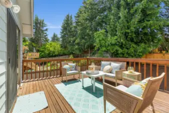 Large back deck off dining area overlooks fully fenced back yard.