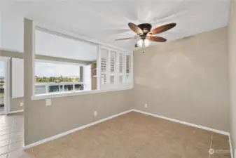 Bedroom/living room divider with shutters rolled away