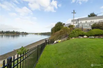 Lower community lawn with beach access in center of image