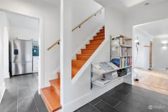 Great display shelves in the hallway and fir floors leading you upstairs.