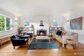 Step inside to this bright and airy living room. The Fireplace is fully functioning and adorned with an etched tile of Mt. Tahoma.