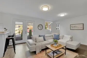 Sitting area, wood-burning fireplace opens to both sides