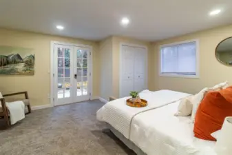 Primary bedroom with two walk-in closets