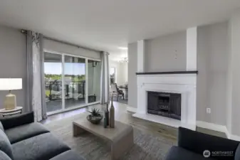 Living room w/cozy fireplace, and open concept living. Virtually staged.