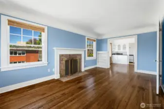 Unit 301 living room, looking into dining area and kitchen