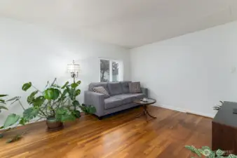 Large living room is freshly painted . Oak hardwood floors have been refinished.