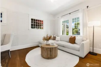 This room is great as a TV room, casual lounging space, and/ or office/ den.