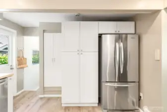 Tons of great storage- this is a large pantry!  The doors to the left go to the lower level and the back yard deck.