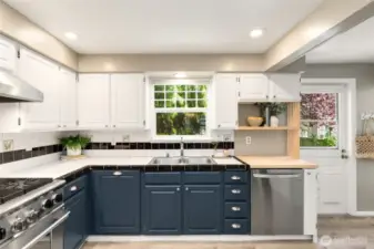 The kitchen opens to the back deck and yard - great for indoor-outdoor entertaining!