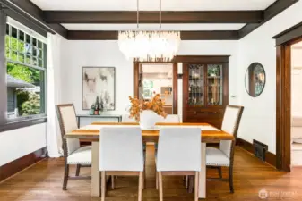 The dining room is very gracious- there is plenty of space for a large table here- great for hosting holidays or casual gatherings!  Notice the gorgeous built-in cabinet with leaded glass.